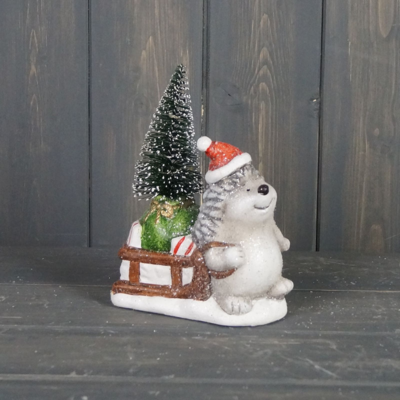 Hedgehog to the right with Sledge and Light Up Tree detail page